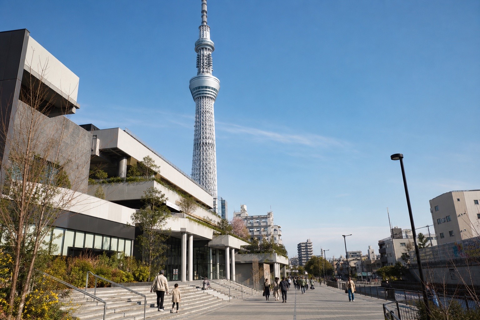 Tokyo Skytree rising beside a pedestrian approach in Solamachi