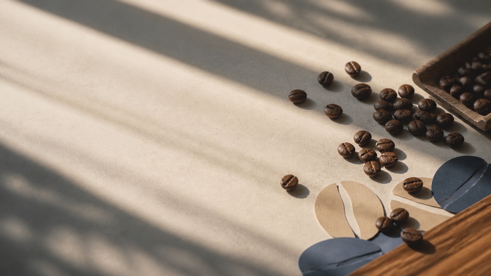 Coffee beans in angled morning light on a neutral tabletop